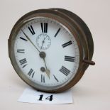 An early 20th century brass cased ship's clock,