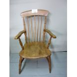 A 19th century oak and elm spindle back country armchair with turned legs and supports est: £40-£60