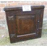 A rustic 18th century oak wall hanging cupboard with two fixed shelves to interior and original