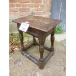 An 18th century oak joint stool with turned legs est: £50-£80