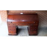 A fantastic quality Victorian mahogany roll top desk with a fully fitted interior and pull out