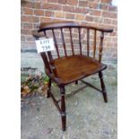 A 19th century mahogany Captain's chair with turned legs and supports bears label to underside