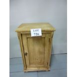 A Victorian pine bedside cupboard with a single panelled door and bun feet est: £30-£50