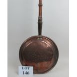 A Victorian copper warming pan with naiv