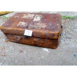 An old brown leather travelling trunk wi