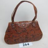 A vintage ladies snakeskin handbag est: