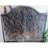 A reproduction cast iron fire back with