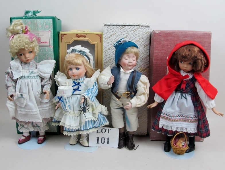 Four modern ceramic dolls in costumes, w