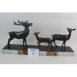 A French Art Deco bronzed spelter group of stag and deer, on marble base,