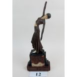A stylish reproduction Art Deco style figure of a female dancer, marbled base,