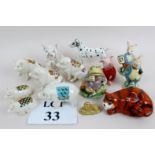 Fourteen ceramic figures, including seven crested pigs, a damaged Coalport Cheshire cat,