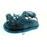 A modern bronzed group of rutting stag, shaped plinth base,