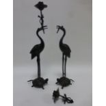 Pair of Chinese bronze candlesticks in the form of a Crane atop a Turtle,