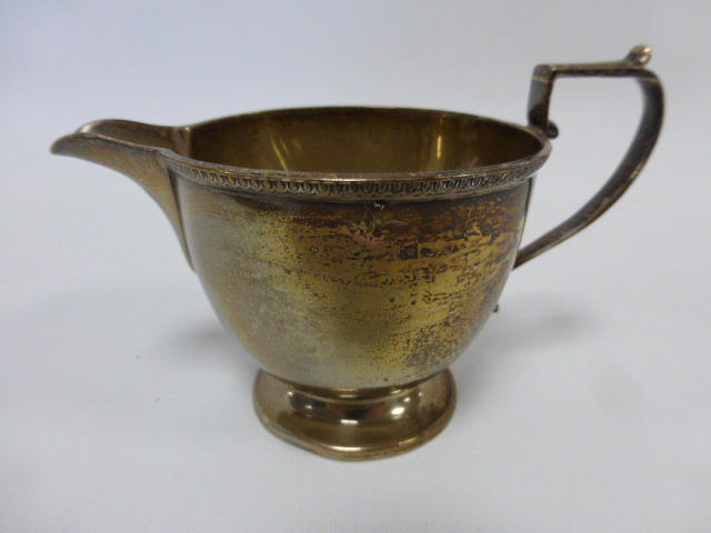 Small silver cream jug with beaded border, hallmarked Birmingham 1923 by makers Docker & Burn Ltd,