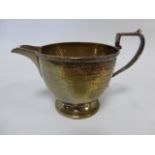 Small silver cream jug with beaded border, hallmarked Birmingham 1923 by makers Docker & Burn Ltd,