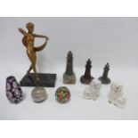 Art Deco figure of a dancing girl on marble base, three stone lighthouses on rocks,