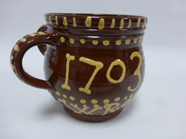 A two handled slipware pot, decorated to body 'I E 1703 WROTHAM', incised monogram to base, 15. - Image 3 of 4