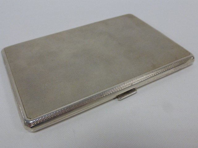 A quality silver cigarette case with engine turned decoration, hallmarked London 1930,