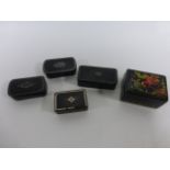 Four 19th century snuff boxes together with a Russian lacquered box.