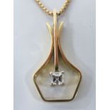 A 14ct gold Diamond set swing pendant necklace, the pendant set with princess cut diamond,