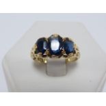 18ct gold three stone Sapphire ring, size Q.