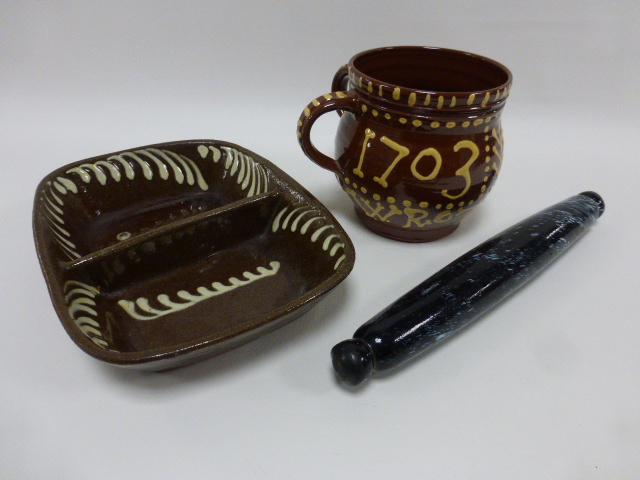 A two handled slipware pot, decorated to body 'I E 1703 WROTHAM', incised monogram to base, 15.