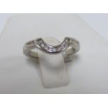 Platinum and Diamond shaped wedding ring, set with fifteen brilliant round cut diamonds, size H/I.