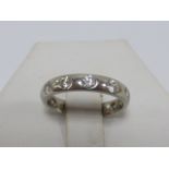 Platinum and Diamond full eternity ring, set with twelve brilliant cut round diamonds, size K.