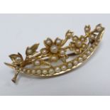 Victorian gold crescent brooch set with seed pearls, tests as 18ct gold, 4cms in length.