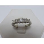 Platinum and five stone princess cut Diamond ring, size K.