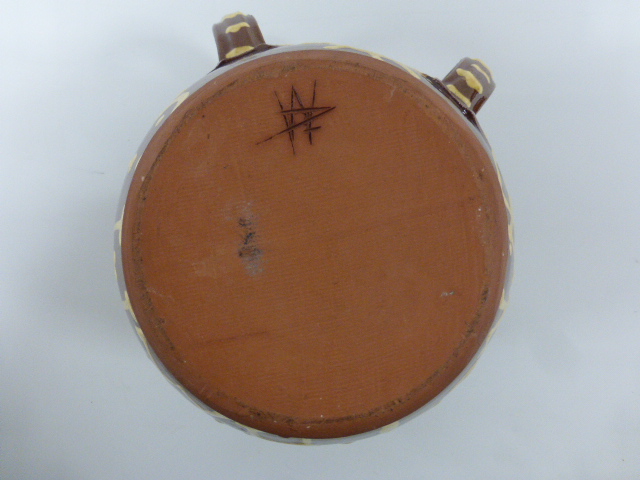 A two handled slipware pot, decorated to body 'I E 1703 WROTHAM', incised monogram to base, 15. - Image 4 of 4