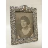 Early 20thC Goldsmiths & Silversmiths silver photograph frame embossed with mythical creatures and