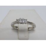 Platinum and three stone princess cut Diamond ring, size M.