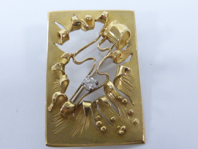 An 18ct gold Diamond set designer brooch