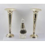 A PAIR OF SILVER VASES of trumpet form on loaded platform bases, marks rubbed, 22.5cm high, together