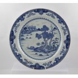 A 19TH CENTURY CHINESE PORCELAIN PLATE, hand painted with blue landscape decoration, 36cm diameter