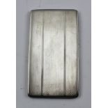 A SILVER CIGARETTE CASE, having engine turned decoration, Birmingham 1938, 227g.