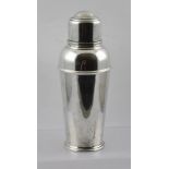 A SILVER PLATED ART DECO DESIGN COCKTAIL SHAKER, 23cm high