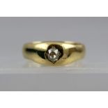 AN 18CT GOLD AND DIAMOND SOLITAIRE UNISEX RING, set with a single half carat diamond in gypsy