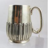 MAPPIN & WEBB A LATE VICTORIAN SILVER TANKARD, having plain handle and fluted decoration to the