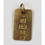 A 9CT GOLD INGOT PENDANT with suspension ring, 5g