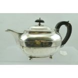 JOHN EMES A GEORGE III SILVER TEAPOT of rectangular banded form, raised on ball feet, London 1807,