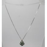 A 14CT WHITE GOLD EMERALD CLUSTER PENDANT AND CHAIN, pendant 1.5cm diameter