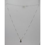 A WHITE GOLD SOLITAIRE DIAMOND PENDANT and a 9ct white gold chain, total weight 3g