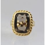 A 9CT GOLD CITRINE RING, the citrine within a gold rope twist effect frame, size M, total weight 6g.