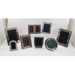 A PAIR OF PLAIN SILVER PHOTOGRAPH FRAMES with easel backs, will display an image of 17cm x 12cm,
