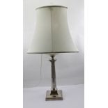 HAWKSWORTH EYRE & CO. LTD. AN EDWARDIAN SILVER COLUMNED OIL LAMP BASE (converted for electricity),