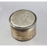 A GEORGE III SILVER ROUGE POT of cylindrical form, the cover engraved with monogram, London 1807,