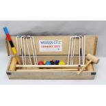 A "WEBBER - C.P.J. LTD." CROQUET SET in wooden box with rules "Elements of Croquet"