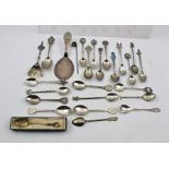 A COLLECTION OF TWENTY-FIVE ASSORTED SILVER AND SILVER PLATE SOUVENIR COLLECTOR'S SPOONS